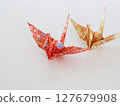Origami cranes on white background 127679908
