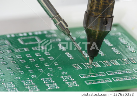 The automatic soldering machine operation with PCB board. The automatic soldering machine operation with PCB board. 127680358