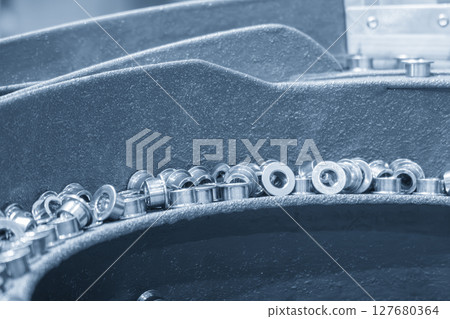 The vibration blow feeder operation with metal bush parts. 127680364