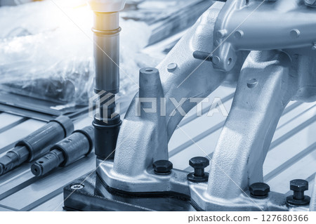 Automotive parts assembly process by the pneumatic wrench in the light blue scene. 127680366