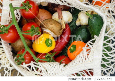 Background surface of various vegetables in white mesh net bag 127680568
