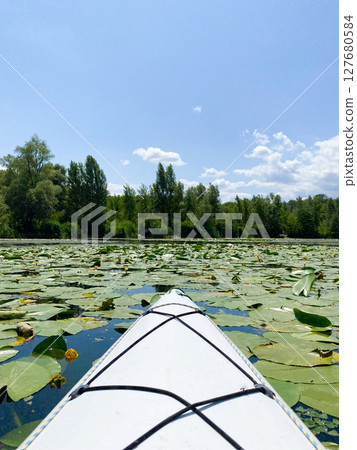 Kayaking on the river, wild nature of Europe, calm water, unity with nature 127680584