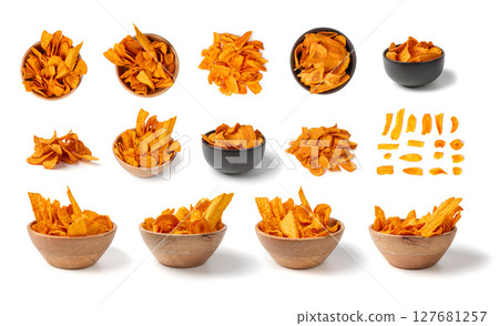 Dry carrot chips isolated, dried sliced red vegetable, healthy crispy snack flakes pile Dry carrot chips isolated, dried sliced red vegetable, healthy crispy snack flakes pile 127681257