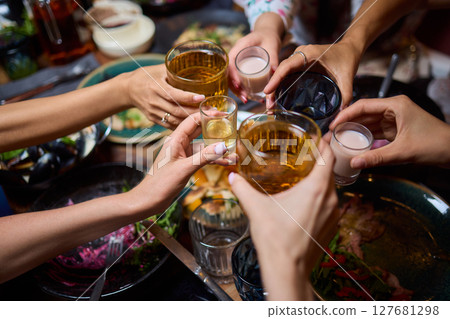 Join us for a delightful gathering where well enjoy drinks and a wide variety of delicious food Join us for a delightful gathering where well enjoy drinks and a wide variety of delicious food 127681298