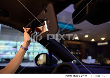 The modern car interior features a sleek vanity mirror that highlights both functionality and style 127681328