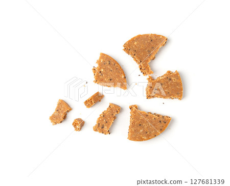 Protein cookie isolated, broken round energy snack with peanuts, chicory fibre Protein cookie isolated, broken round energy snack with peanuts, chicory fibre 127681339