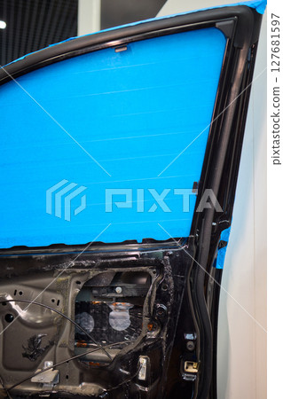 Hands Engaged in the Process of Performing Automotive Interior Repairs Effectively Hands Engaged in the Process of Performing Automotive Interior Repairs Effectively 127681597
