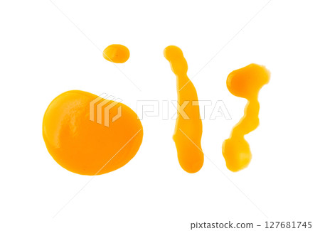 Spilled orange juice isolated, mango smoothie puddle, liquid stain, carrot juice splatter 127681745