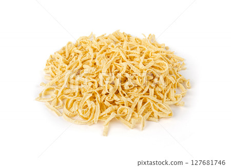 Passatelli spatzle pasta isolated, raw spaetzle noodles, dry homemade german macaroni Passatelli spatzle pasta isolated, raw spaetzle noodles, dry homemade german macaroni 127681746