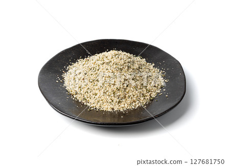 Shelled hemp seeds pile isolated, peeled cannabis grains, marijuana kernels without peel 127681750