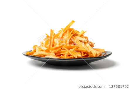 Fried chips sticks isolated, finger potato chips, golden shoestring fries pile, French fries 127681792