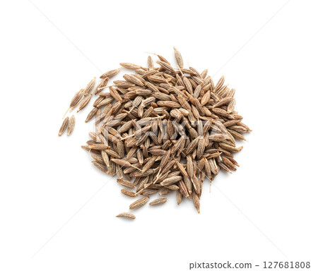 Cumin seed isolated. Caraway or fennel dry seeds close up, zeera macro, Indian cumin or zira grains 127681808
