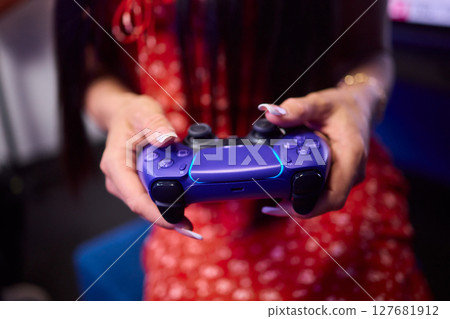 Experience an Exciting Gaming Moment with a Game Controller Firmly in Your Hand Today 127681912