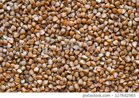 Brown and Close up Buckwheat Grains Background Brown and Close up Buckwheat Grains Background 127682065