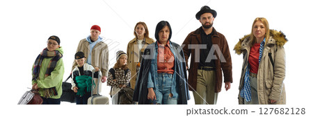 Diverse group of determined people with luggage and coats symbolizing global migration and crisis Diverse group of determined people with luggage and coats symbolizing global migration and crisis 127682128