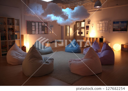Modern classroom with bean bags and cloud lights 127682254