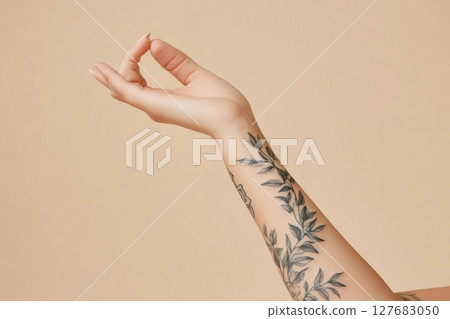 Hand Practices Yoga Pose with Botanical Tattoo Arm for Relaxing Mind Theme Hand Practices Yoga Pose with Botanical Tattoo Arm for Relaxing Mind Theme 127683050