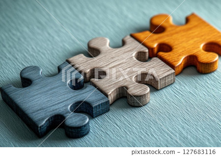 Wooden Puzzle Pieces connect on Blue, showing unity and problem Solving Concept 127683116