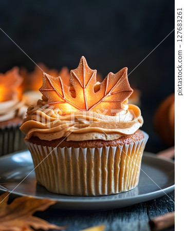 An_autumn_cupcake_with_glowing_sugar_leaves 127683261