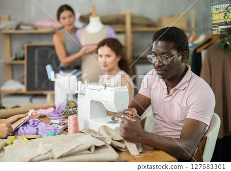 Participants in coterie practice sewing, chatting and talking, work with mannequin Participants in coterie practice sewing, chatting and talking, work with mannequin 127683301