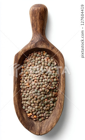 Dried Lentils in Wooden Scoop on White Background for Ingredient Visuals 127684419
