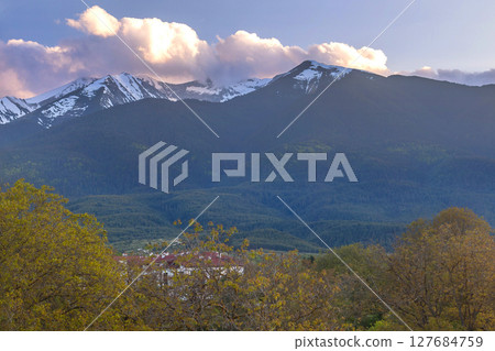 Bansko, Bulgaria spring, Pirin sunset panorama Bansko, Bulgaria spring, Pirin sunset panorama 127684759
