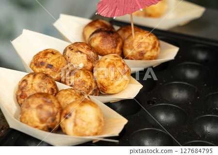 Takoyaki - traditional Japanese street food, outdoor snack with octopus Takoyaki fried balls Takoyaki - traditional Japanese street food, outdoor snack with octopus Takoyaki fried balls 127684795