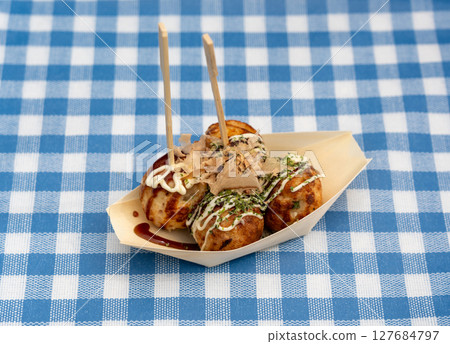 Takoyaki - traditional Japanese street food, outdoor snack with octopus Takoyaki fried balls 127684797