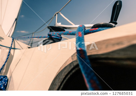 Winch capstan with rope on sailing boat. 127685031