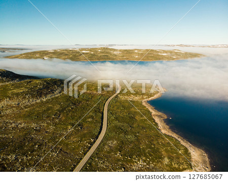 Road crossing Hardangervidda plateau, Norway. Aerial view. 127685067
