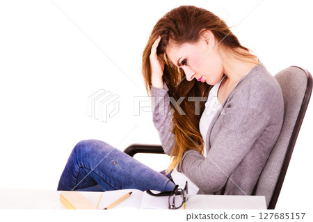 Woman suffering from headache migraine pain 127685157