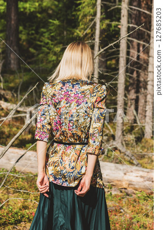Woman walking in the forest Woman walking in the forest 127685203