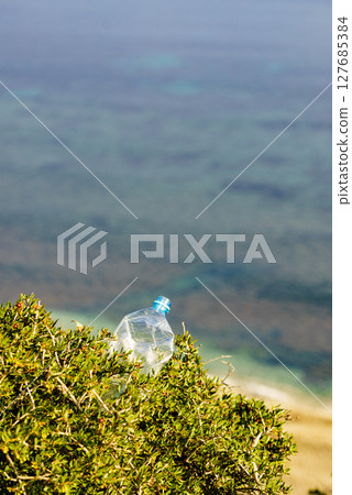 Plastic used water bottle on nature Plastic used water bottle on nature 127685384
