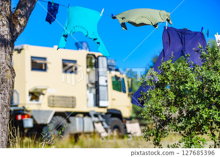 Camping. Clothes hanging to dry by rv lorry motorhome. Camping. Clothes hanging to dry by rv lorry motorhome. 127685396