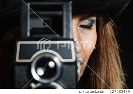 Retro woman with old camera. Steampunk. Retro woman with old camera. Steampunk. 127685489