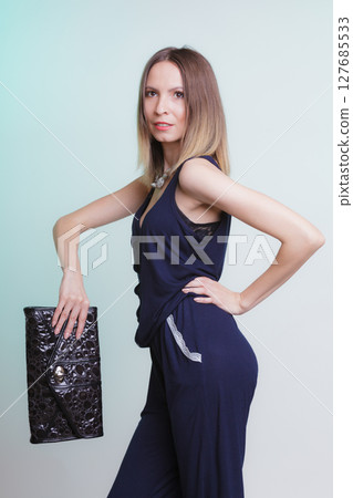 Elegant fashion woman with leather handbag Elegant fashion woman with leather handbag 127685533