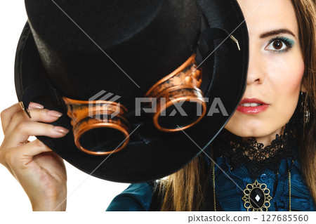Portrait of beautiful steampunk woman isolated. Portrait of beautiful steampunk woman isolated. 127685560