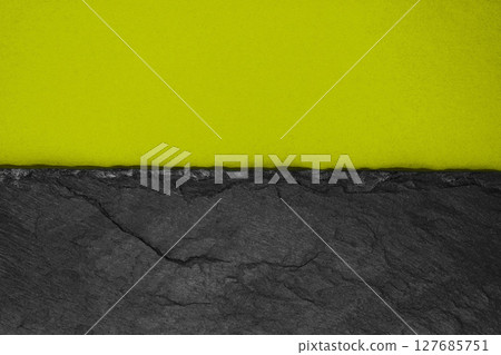 Abstract background composition of divided in the half matt dark yellowish green color paper and black stone with copy space Abstract background composition of divided in the half matt dark yellowish green color paper and black stone with copy space 127685751
