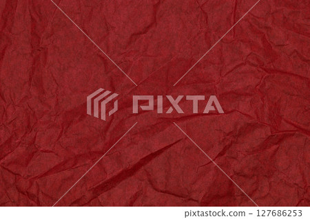 Background surface of wrinkled red and crumpled paper 127686253