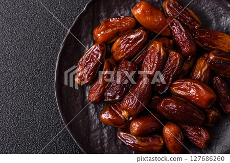 Dried tropical date fruit as an ingredient for fresh organic diet food 127686260