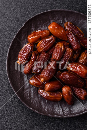 Dried tropical date fruit as an ingredient for fresh organic diet food Dried tropical date fruit as an ingredient for fresh organic diet food 127686261