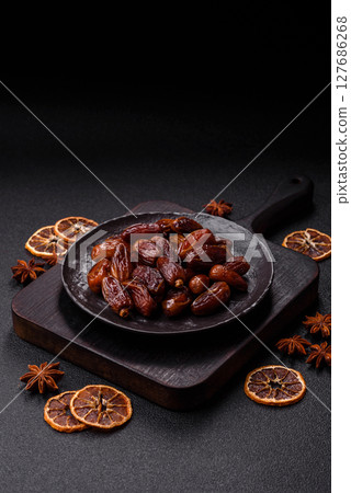 Dried tropical date fruit as an ingredient for fresh organic diet food 127686268