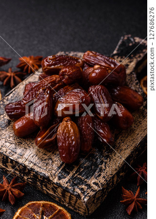 Dried tropical date fruit as an ingredient for fresh organic diet food Dried tropical date fruit as an ingredient for fresh organic diet food 127686276