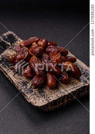Dried tropical date fruit as an ingredient for fresh organic diet food 127686280