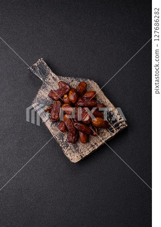 Dried tropical date fruit as an ingredient for fresh organic diet food Dried tropical date fruit as an ingredient for fresh organic diet food 127686282