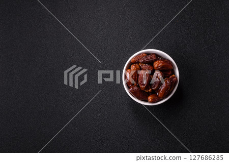 Dried tropical date fruit as an ingredient for fresh organic diet food Dried tropical date fruit as an ingredient for fresh organic diet food 127686285