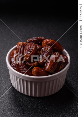 Dried tropical date fruit as an ingredient for fresh organic diet food 127686291
