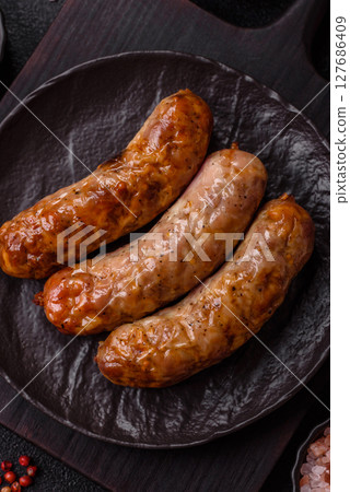 Grilled pork or beef sausages 127686409