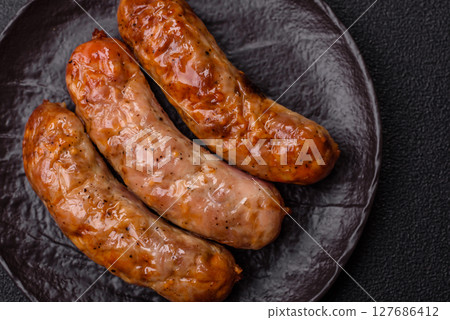 Grilled pork or beef sausages 127686412