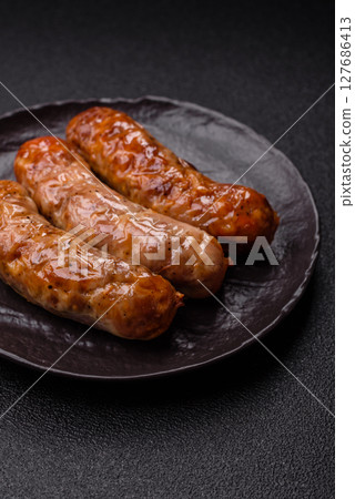 Grilled pork or beef sausages Grilled pork or beef sausages 127686413